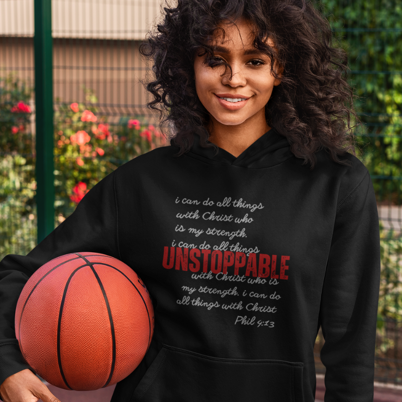 Young female basketball player wearing black hoodie from unstoppable collection
