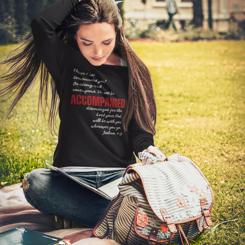 Black-sweatshirt-mockup-of-a-student-sitting-on-the-grass