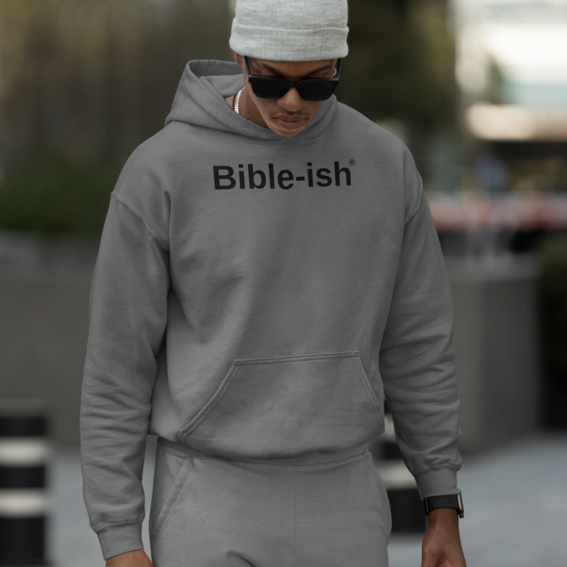 Young man wearing hoodie and jogger set with bible-ish logo